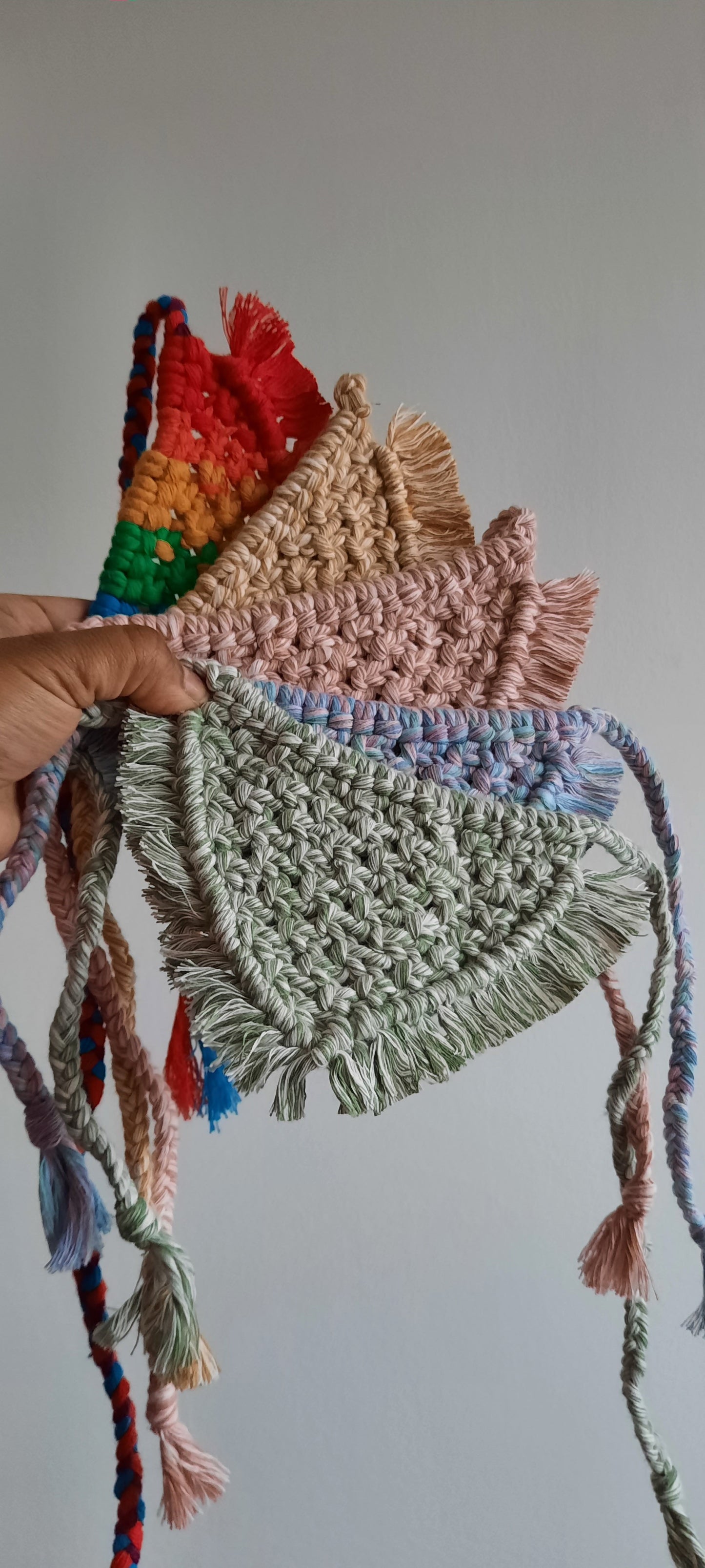 Handmade knotted macrame pet bandana with colorful yarn