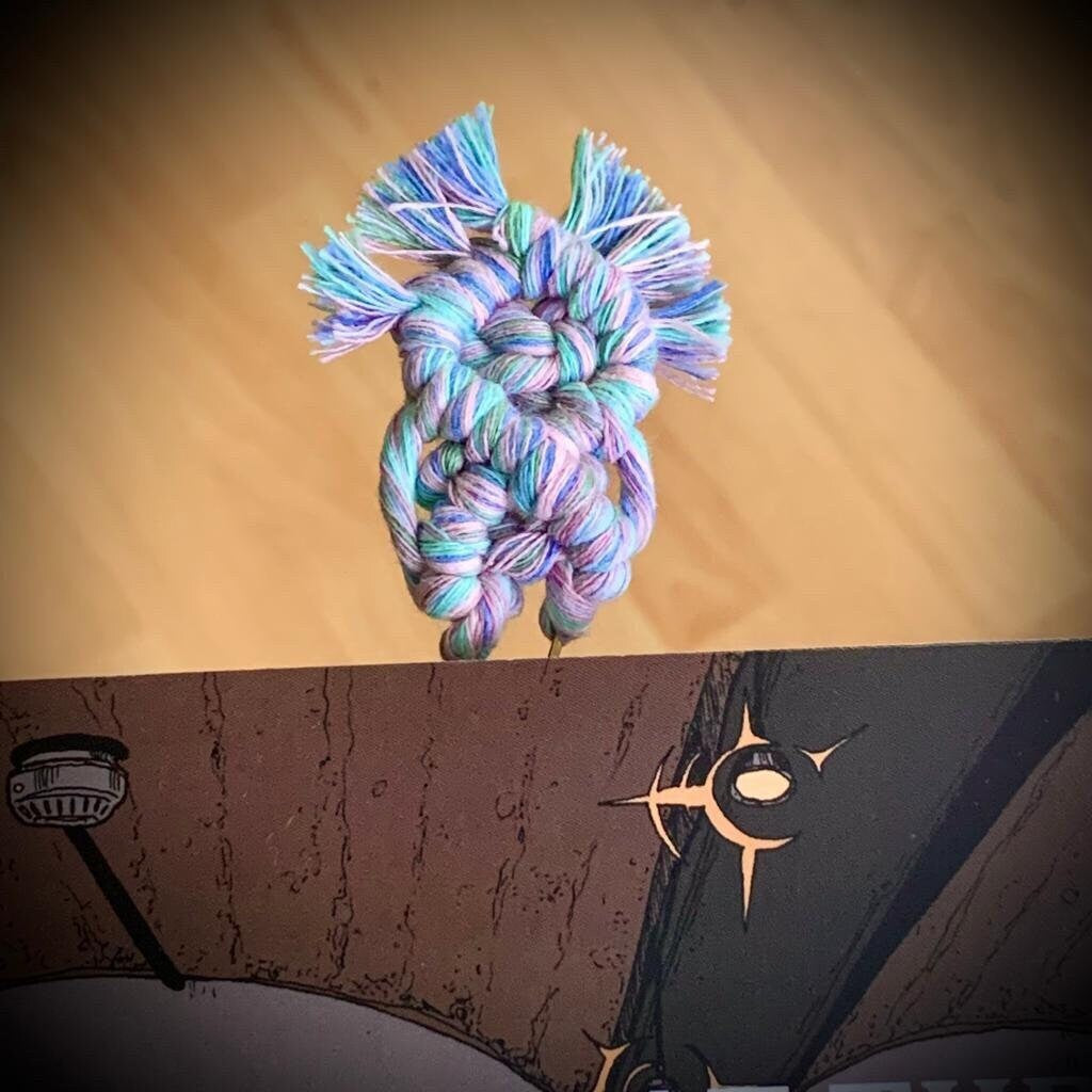 Colorful knotted rope bookmark u clip on a  book